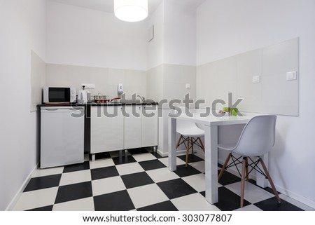 White and black small and compact kitchen interior design