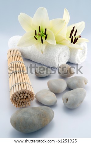 White towels and stones on white background