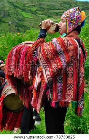 SACRED VALLEY, PERU - MARCH 09: Musician plays a musical instrument during traditional peruvian wedding ceremony in Sacred Valley near Cuzco, Peru on March 09, 2010.