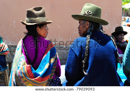 PISAC, PERU, SOUTH AMERICA - MARCH 07: Woman is presenting her souvenirs on sunday market in Pisac on March 07 2010 in Pisac, peru, south america.