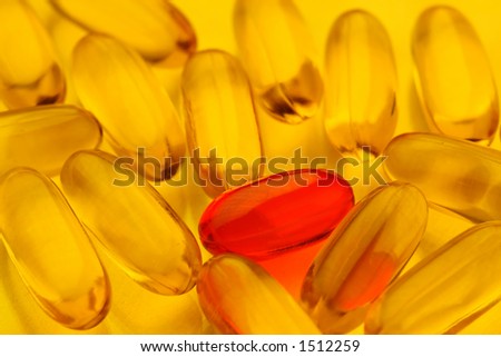macro of pills with red pill standing out