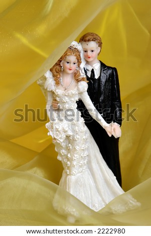 Wedding Cake Dolls with yellow background