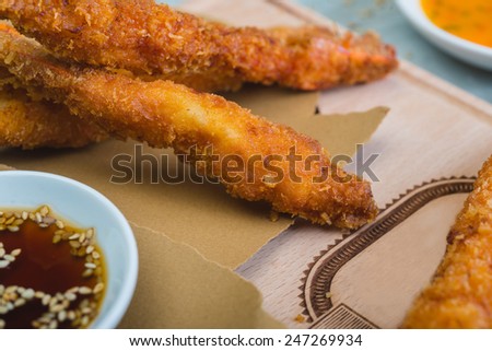Tempura Shrimps (Deep Fried Shrimps) with sweet sauce on a wooden table