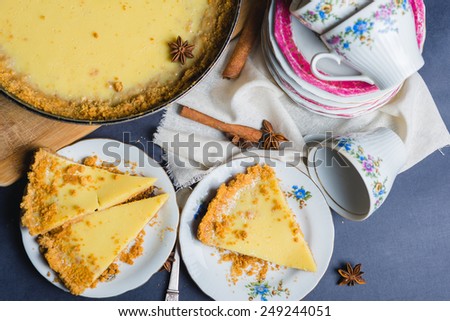 Top view of delicious homemade cake filled with lemon and sweet milk with decor