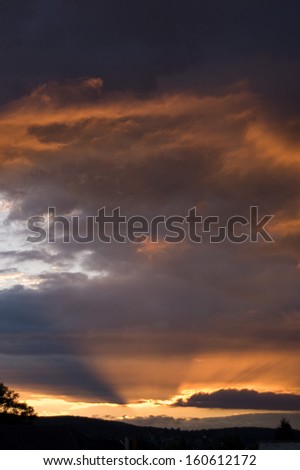 Sunset after storm with dark clouds