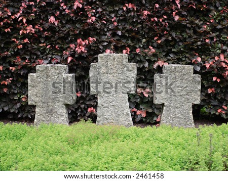 Three cross shaped tombstones without inscription