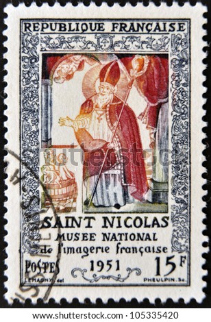 FRANCE - CIRCA 1951: A stamp printed in France shows Saint Nicholas, the French national museum of imagery, circa 1951
