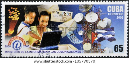 CUBA - CIRCA 2005: A stamp printed by CUBA shows to people using computer, tower, mobile 5 th anniversary of theMinistry of computer and communica-tions, series, circa 2005