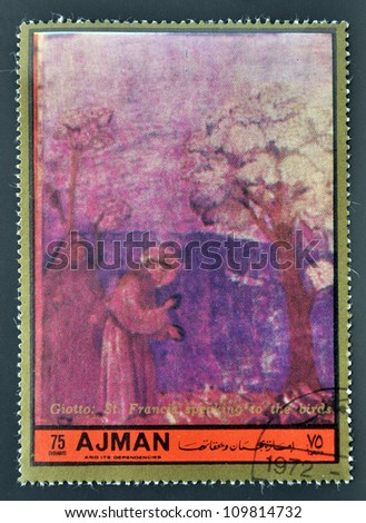 AJMAN - CIRCA 1972: A stamp printed in Ajman Christmas collection, peace in the world, shows a San Francisco fresco birds specking the work of Giotto, circa 1972