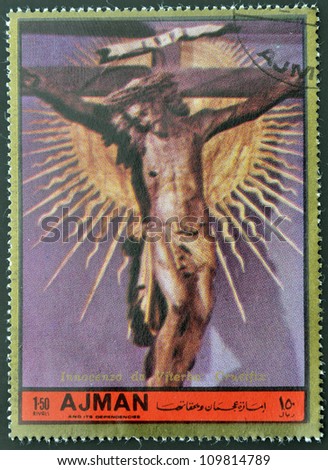 AJMAN - CIRCA 1972: A stamp printed in Ajman Christmas collection, peace in the world, shows a sculpture of the crucifixion of Christ work Inocenzo di Viterbo , circa 1972