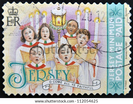JERSEY - CIRCA 2007: A Christmas stamp printed in Jersey shows children's choir singing come all ye faithful, circa 2007