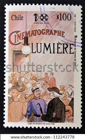 CHILE - CIRCA 1995: A stamp printed in chile shows poster commemorating the first movie of cinema, circa 1995
