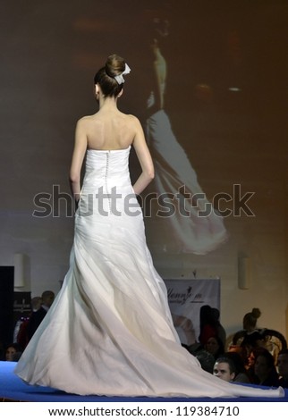 GRANADA, SPAIN - NOVEMBER 17: Models back with a wedding dress walks the catwalk at the First Bridal Fair Granada on November 17, 2012 in Granada, Spain