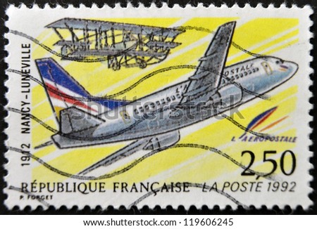 FRANCE - CIRCA 1992: A postage stamp printed in France shows the plane that made the first trip zip between Nancy and Luneville in 1912, circa 1992.