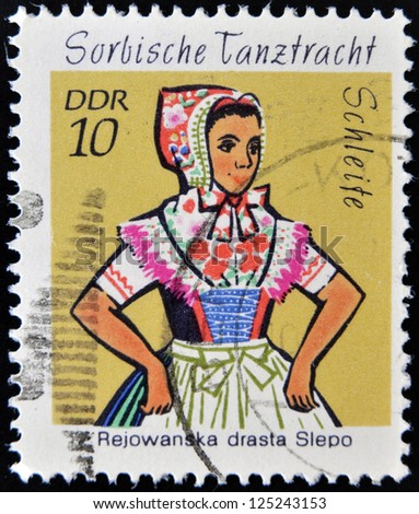 EAST GERMANY- CIRCA 1971: stamp printed in Germany shows Dance Costume Schleife, circa 1971.