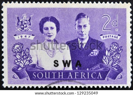 SOUTH AFRICA - CIRCA 1947: A stamp Printed in South Africa shows King George VI and wife, commemorate British Royal family visit to RSA, circa 1947