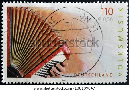 GERMANY- CIRCA 2001: stamp printed in Germany dedicated to Folk Music shows accordion, circa 2001.