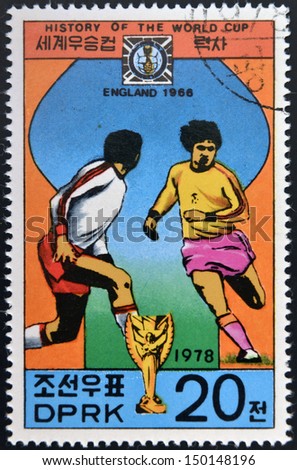 KOREA - CIRCA 1978: Stamp printed in North Korea shows the Soccer players, Cup and Glob with the inscription 