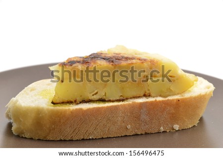 Spanish tortilla (omelet with potatoes and onions) on a slice of bread