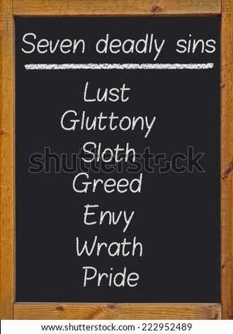 The seven deadly sins written on a blackboard