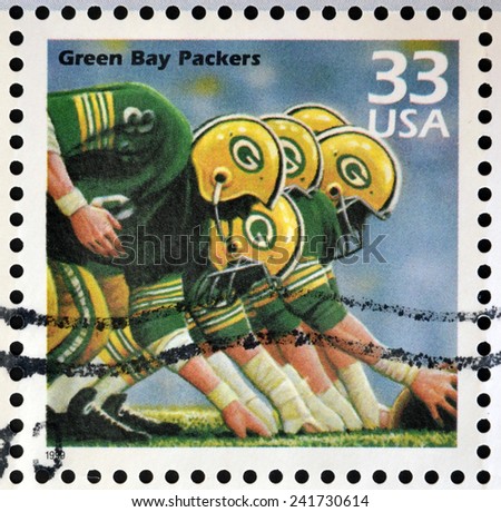 UNITED STATES OF AMERICA - CIRCA 1999: Stamp printed in USA dedicated to celebrate the century 1960s, shows green bay packers, circa 1999