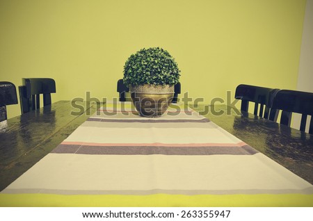 Dining table with vase and table runner