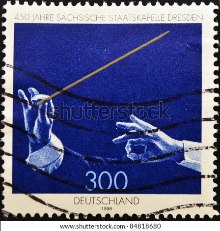 GERMANY - CIRCA 1985: A stamp printed in germany shows a orchestra conductor, circa 1985