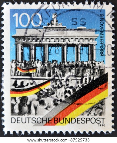 GERMANY - CIRCA 1990: A stamp printed in Germany commemorates the fall of the Berlin Wall on November 9, 1989, circa 1990