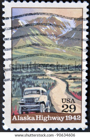 UNITED STATES OF AMERICA - CIRCA 1992: A stamp printed in USA shows Alaska Highway and the machine, circa 1992