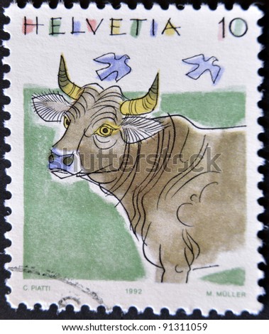 SWITZERLAND-CIRCA 1992: A stamp printed in Switzerland, shows a cow, circa 1992