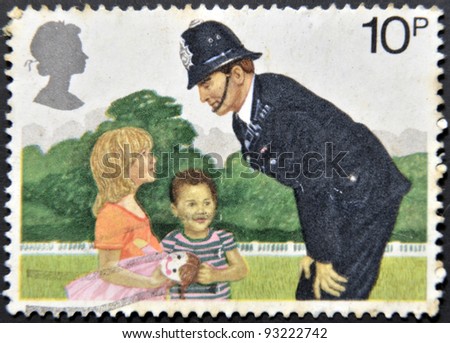 UNITED KINGDOM - CIRCA 1979: a stamp printed in the Great Britain shows Police Constable and Children, 150th anniversary of London Metropolitan Police, circa 1979