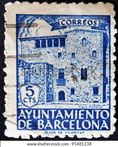 SPAIN - CIRCA 1943: A stamp printed by the City of Barcelona showing the house PadellÃ s, circa 1943
