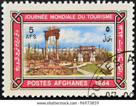 AFGHANISTAN - CIRCA 1984: A stamp printed in Afghanistan dedicated to World Tourism Day, shows the Victory Monument and Memorial Arch, Kabul, circa 1984