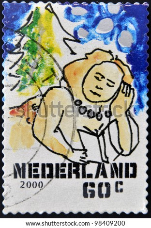 HOLLAND - CIRCA 2000: A stamp printed in Holland shows reclining woman reading, circa 2000