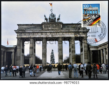 GERMANY - CIRCA 1990: A postcard printed in Germany commemorates the fall of the Berlin Wall on November 9, 1989, shows brandenburg gate, circa 1990