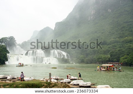VIETNAM, CAO BANG, 15 AUGUST 2014 - Local people and tourists at rafts near Ban Gioc or Detian waterfall at the border between Vietnam and China