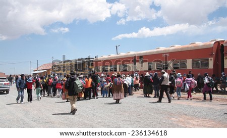 BOLIVIA, TIWANAKU, 8 SEPTEMBER 2013 - People at the Tiwanaku Train station in Bolivia, South America