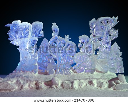 Beautiful winter ice sculpture of a frozen fairytale scene at the ice sculpture carving festival.
