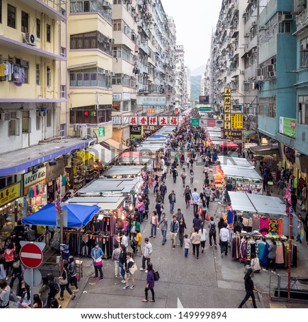 HONG KONG - MAY 04: Crowded market stalls in old district on March 04, 2013 in Hong Kong. With land mass of 1104 km and 7 million people, Hong Kong is one of most densely populated areas in the world.