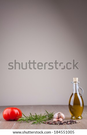 olive oil and spices on wooden table vertical