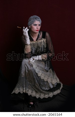 Lady l with a cigarette dressed in  style of the beginning of XX century