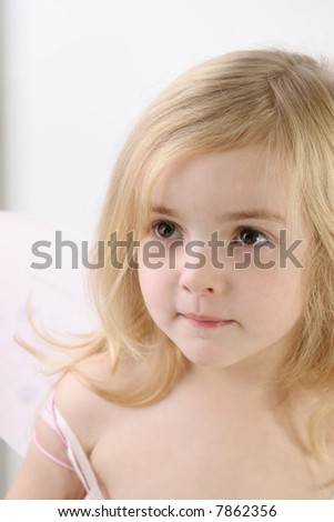 little girl with fairy wings -  over white
