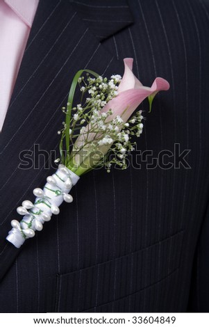 a nice flower decoration of groom suit