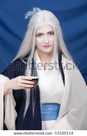 White hair farytalle persomage on tea ceremony