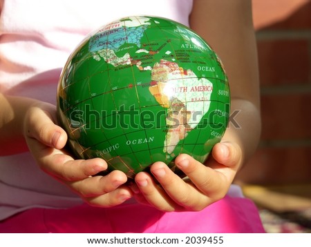 Keep the world for future generation -- Little girl holding a green globe