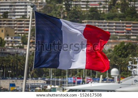 The national flag of France. City of Nice on the Cote d'Azur in the South of France.