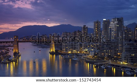 Yaletown and the Burrard Bridge in False Creek in the city of Vancouver, British Columbia in Canada.