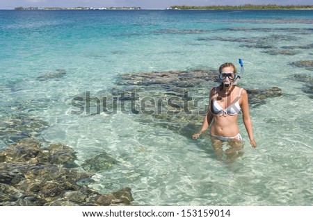 Young woman on a tropical vacation in the Cook Islands in the South Pacific.