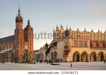 Church of St. Mary and the Cloth Hall in the main Market Square (Rynek Glowny) in the city of Krakow in Poland.