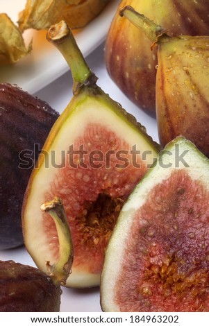 Figs are a soft pear-shaped fruit with sweet dark flesh and many small seeds, eaten fresh or dried.